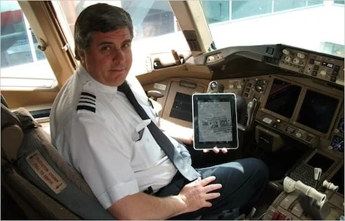 iPad in the cockpit ipad in pilot cabin first officer kelly caglia of american airlines with an ipad in a boeing 777